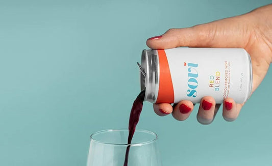 Can of Non-Alcoholic Red Wine Poured into Glass
