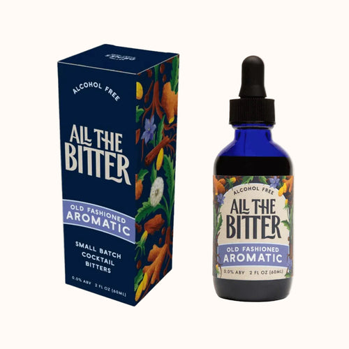 Bottle and box of 'All The Bitter' Old Fashioned Aromatic cocktail bitters on a light gray background